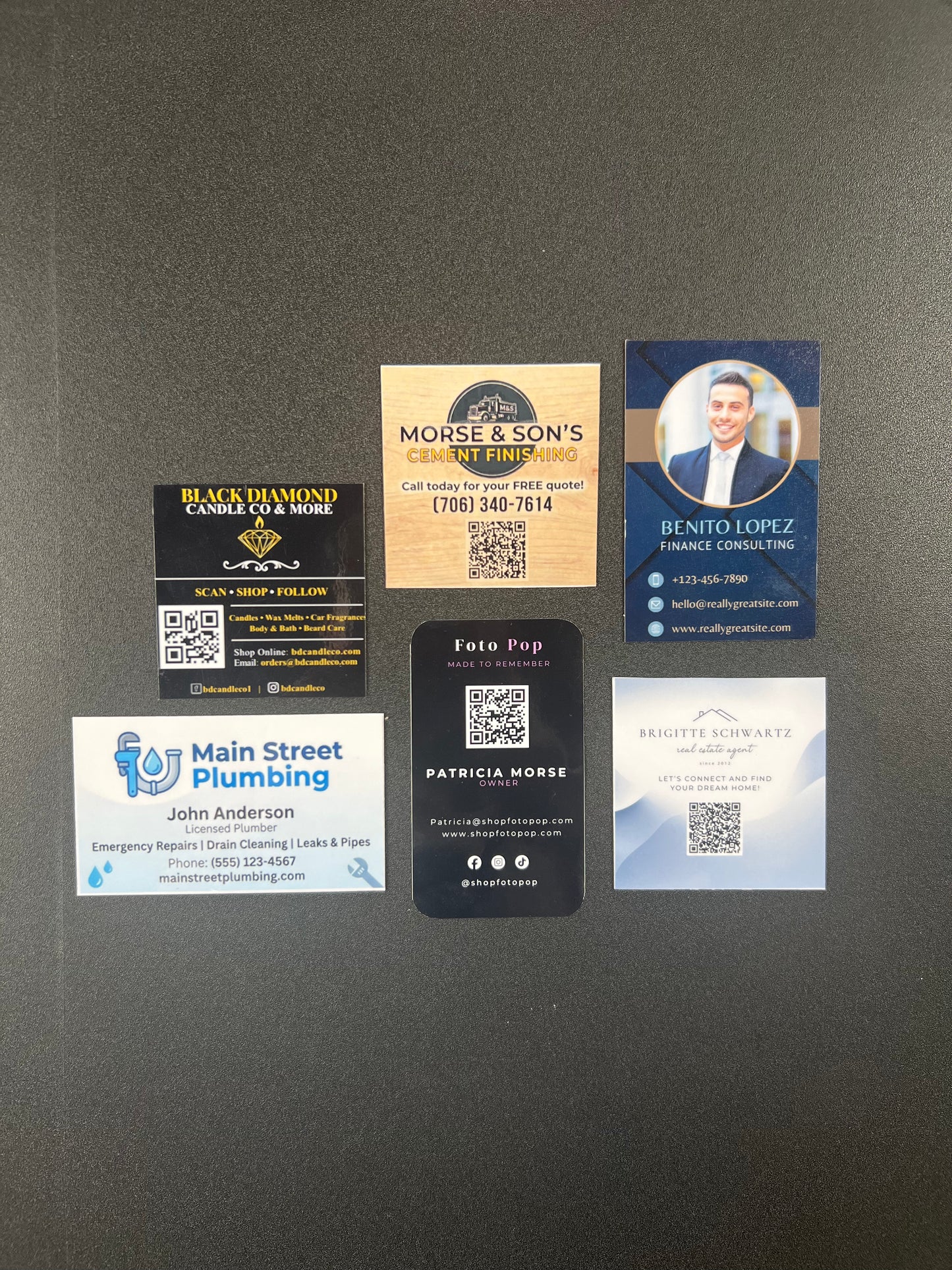 Collection of various business cards on a dark gray background