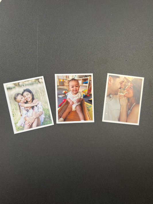 Three family photos on a dark gray surface