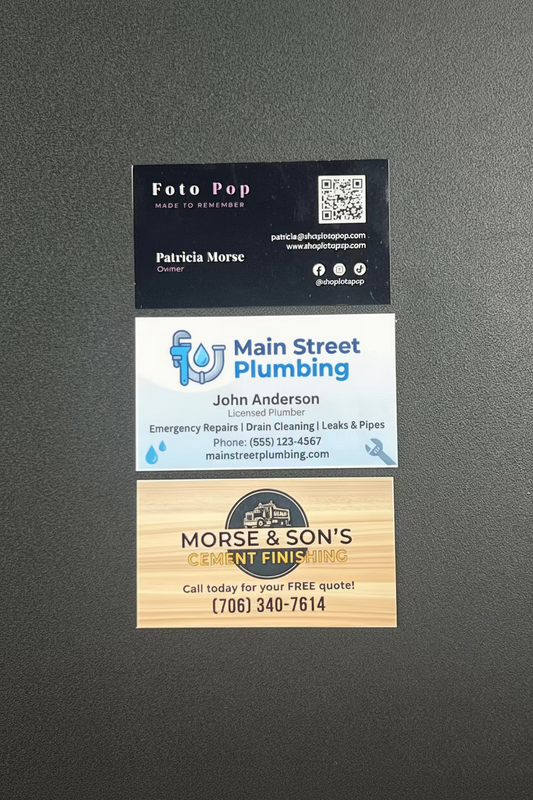 Collection of business cards from different companies on a gray background