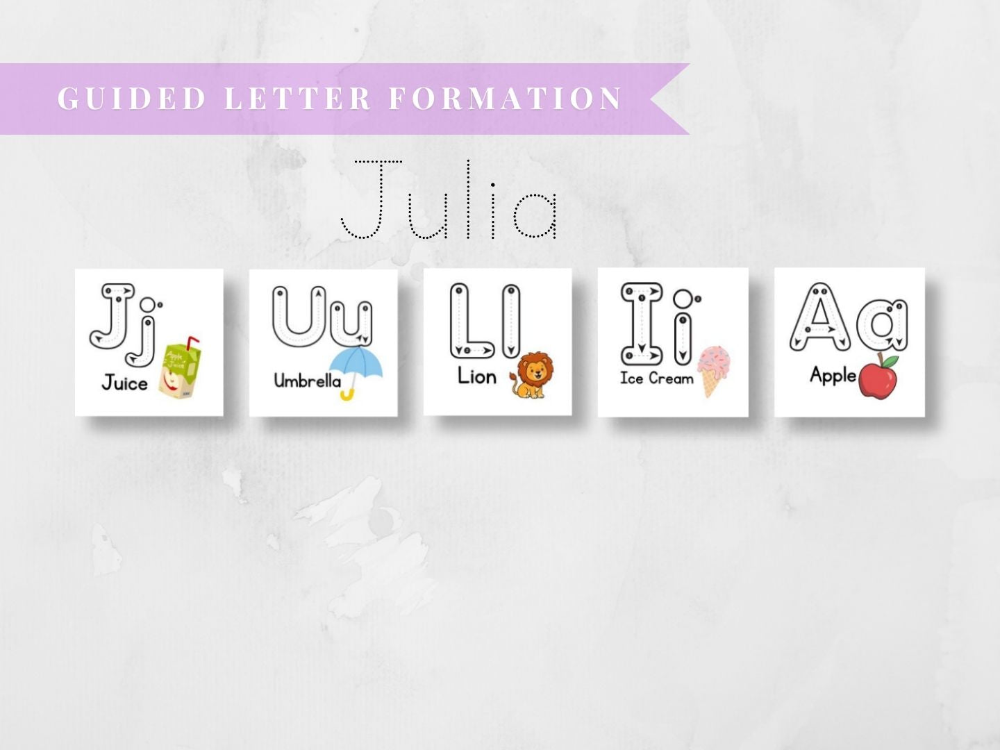A set of five white square cards showing guided letter formation for the letters J, U, L, I, and A, each with a cute cartoon illustration and word underneath. Above the cards, a lavender banner reads 'GUIDED LETTER FORMATION' and the name 'Julia' is centered on a light marble-textured background.