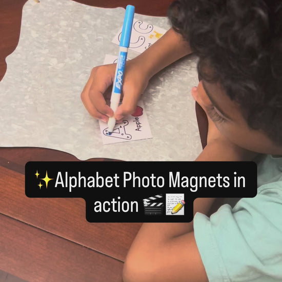 boy tracing the letter A