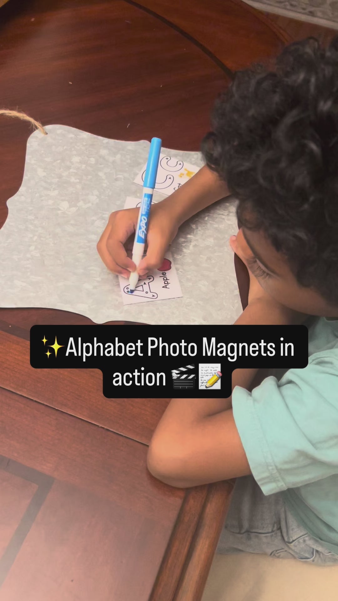 boy tracing the letter A